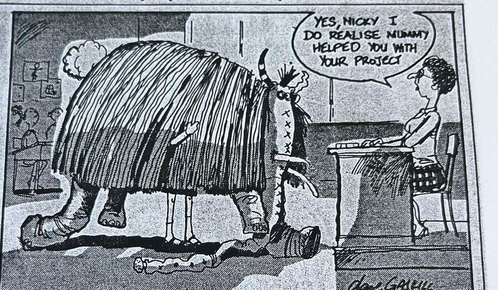 Cartoon accompanying the column: YES, NICKY I DO REALISE MUMMY HELPED YOU WITH YOUR PROJECT, said by a teacher at her desk to a life-sized woolly mammoth filling the classroom.
