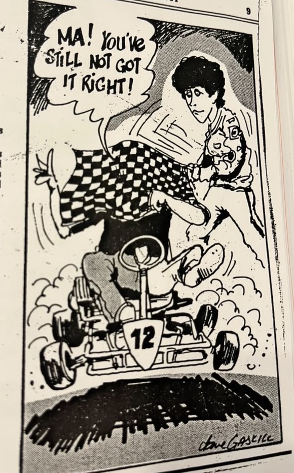 Cartoon accompanying the column: “Ma! You’ve still not got it right!” Carol waves a checked tablecloth as her son races past in his go-cart.